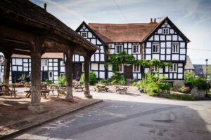 Outside view of Pembridge Square in a black and white village in England