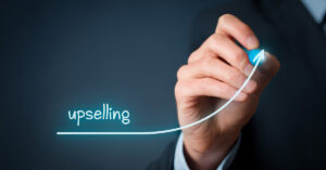 Upselling on-line (e-shop) marketing concept. Sales technique for more profitable sale. Businessman draw growing profit graph thanks upselling.