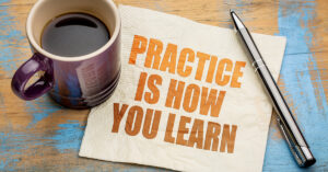 Practice is how your learn - text on a napkin with a cup of espresso coffee