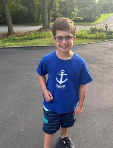 young kid, Asher Cohn, posing for image