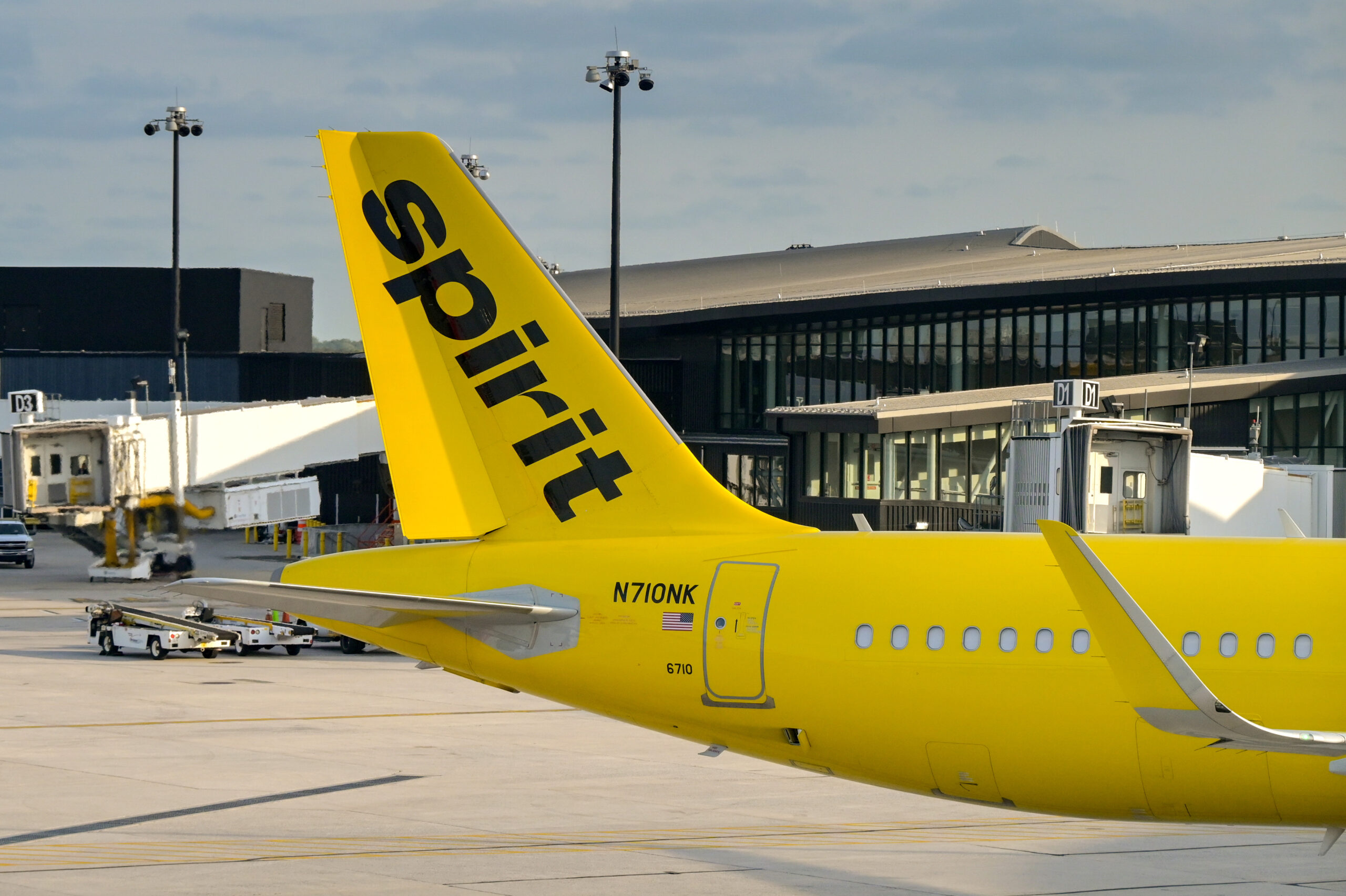 Baltimore, Maryland, USA - 3 May 2024: Tail fin of an Airbus A321 jet (registration N710NK) operated by Spirit Airlines at Baltimore Washington International airport.